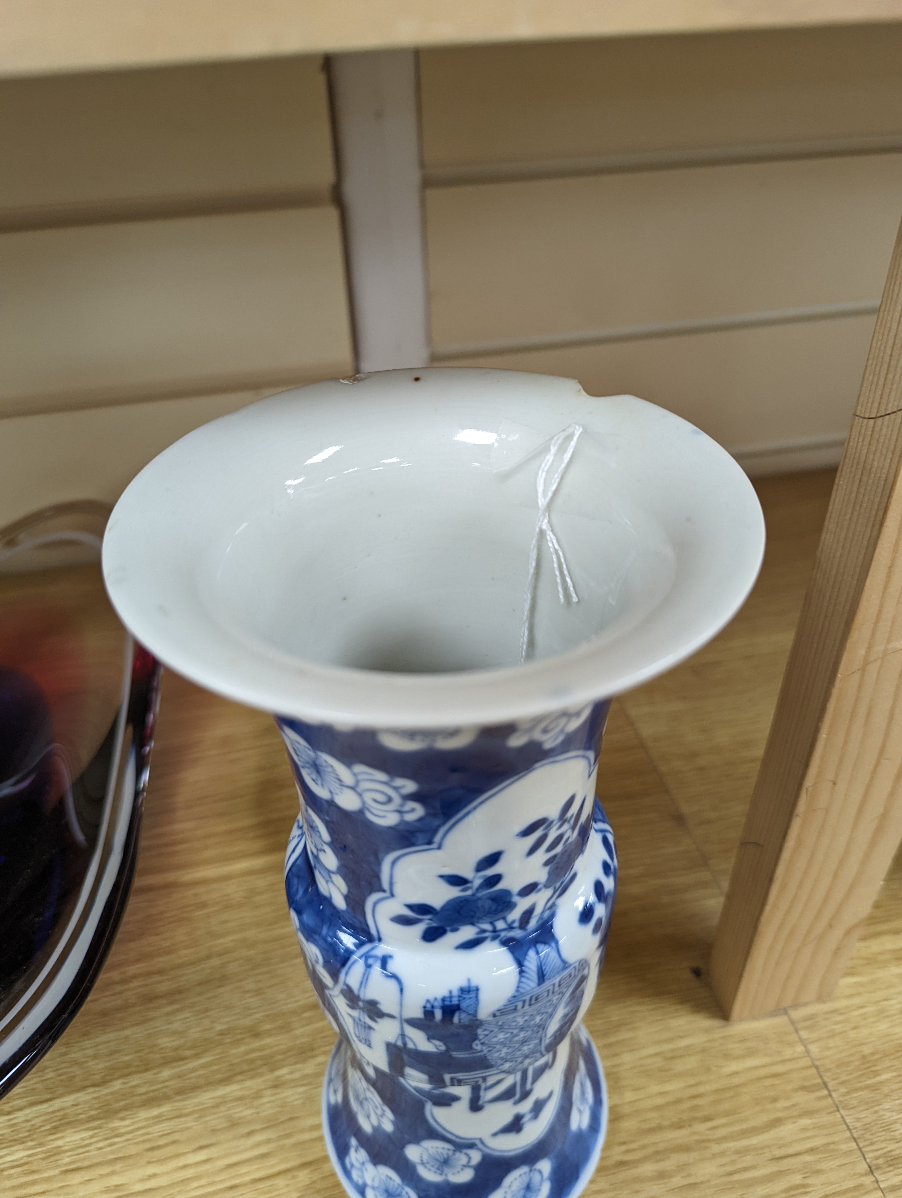 A 19th century Chinese blue and white prunus gu vase, 25 cms high.